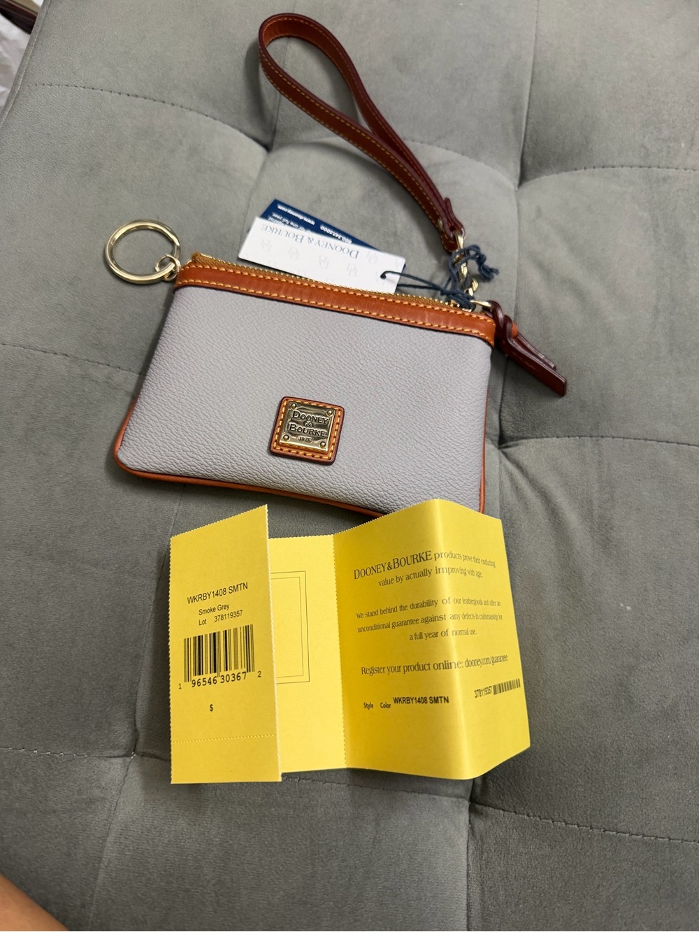 Dooney & Bourke Light Gray Leather Wristlet with Brown Trim and Gold Hardware
